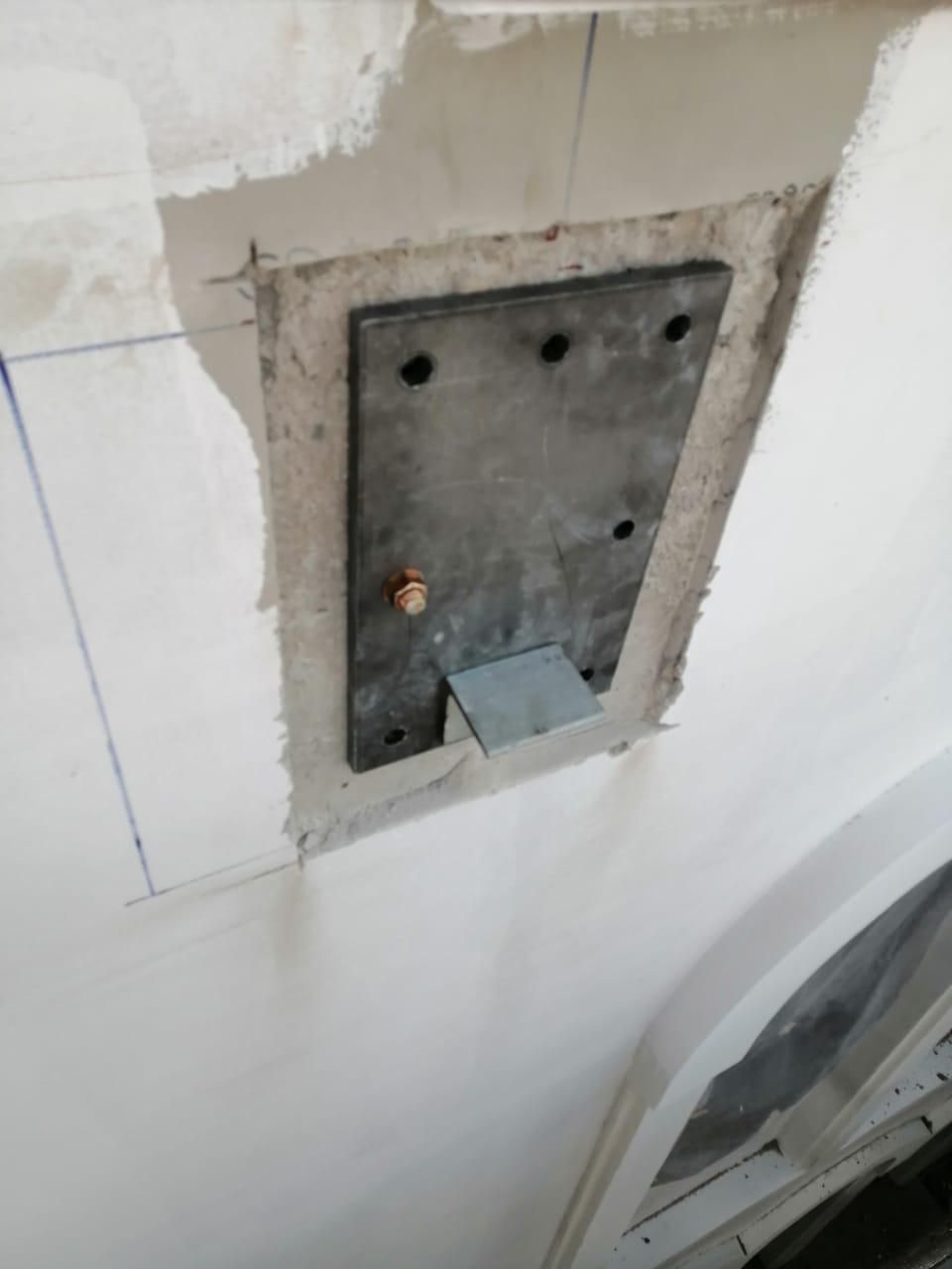 Steel fixing plate anchored into the façade