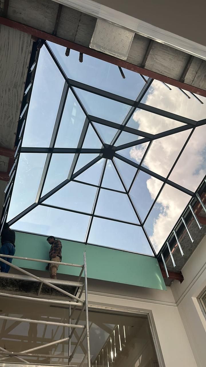 New pyramid glass skylight being installed