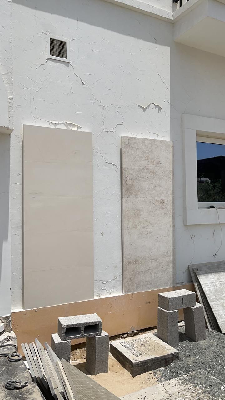 Two stone cladding samples fixed to the façade